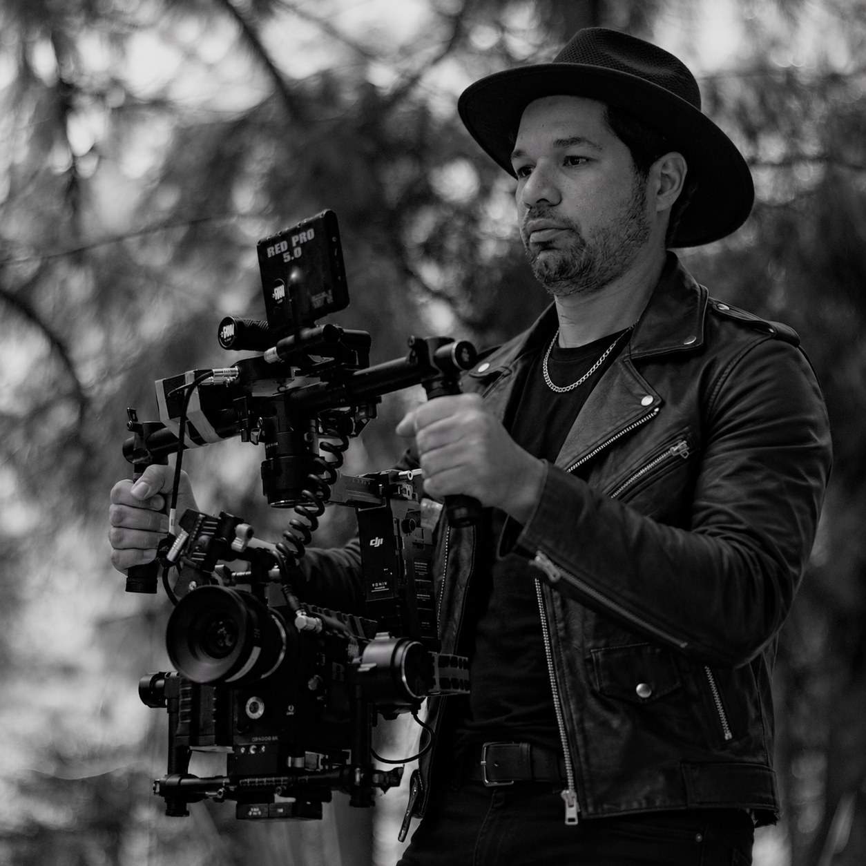 Willmer Williams operating a cinema camera on set